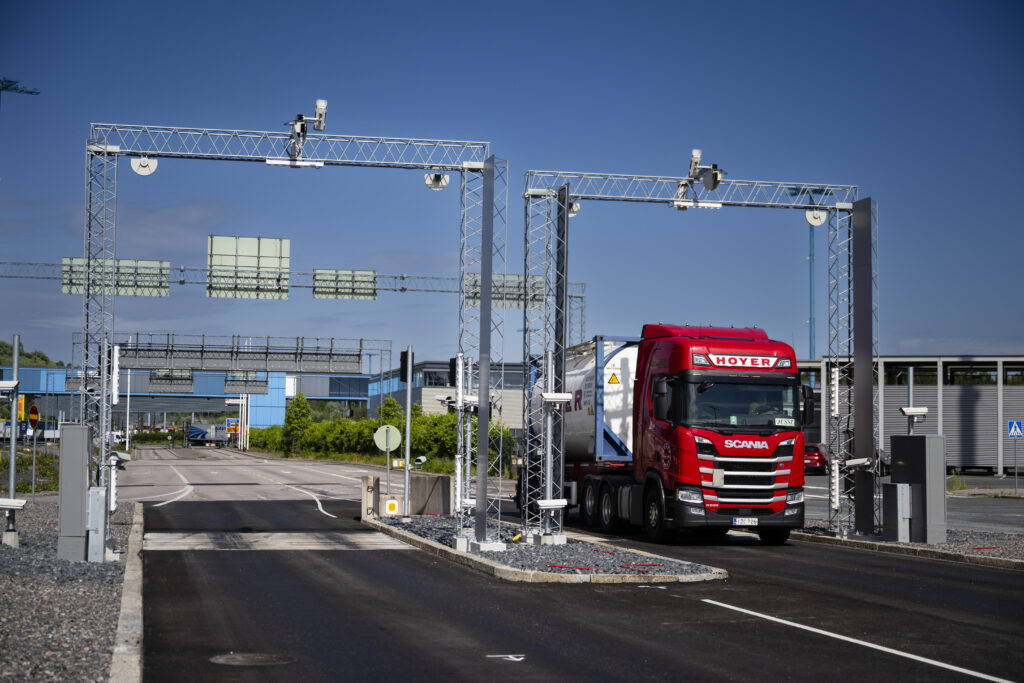 A truck driving through Vuosaari harbour A gate.